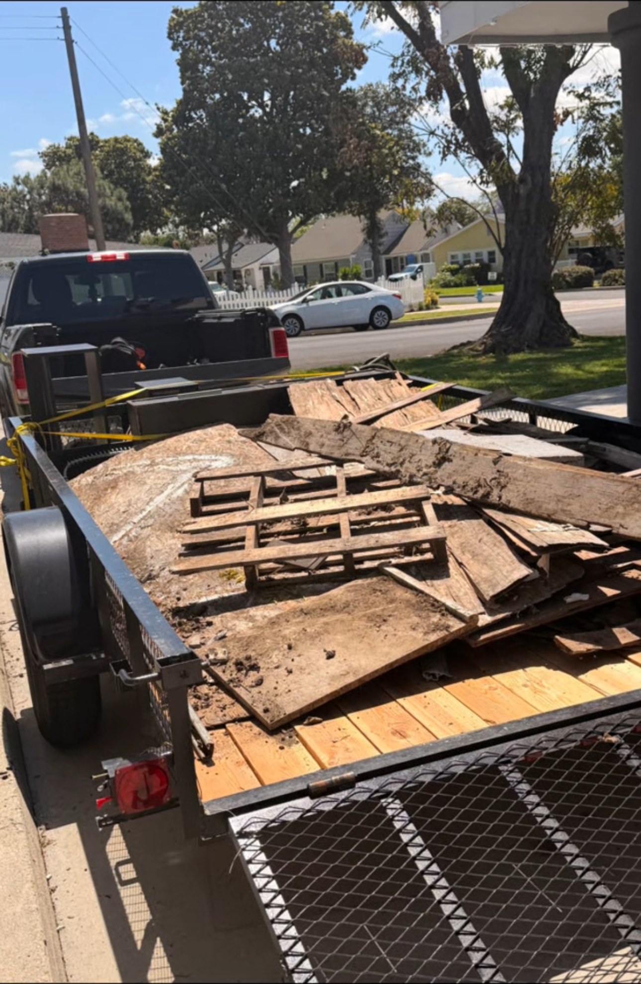 SoCal Cleanup & Hauling trailer loaded with debris